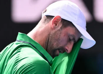Djokovic scrapes into semis after Musetti injury