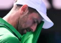 Djokovic scrapes into semis after Musetti injury