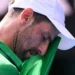 Djokovic scrapes into semis after Musetti injury
