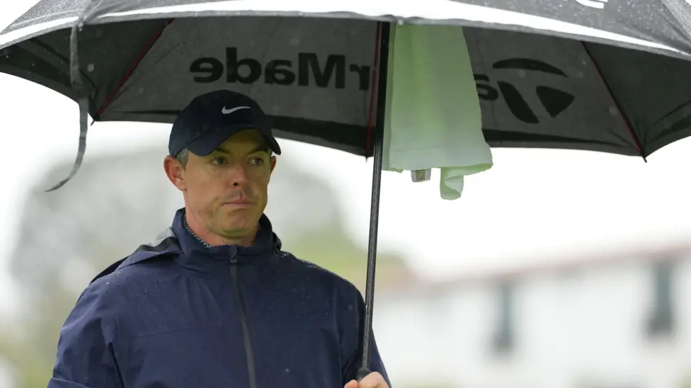 McIlroy sets clubhouse lead at stormy Genesis