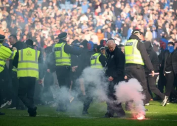‘Shameful’ pitch invasion by Celtic and Rangers fans condemned by police