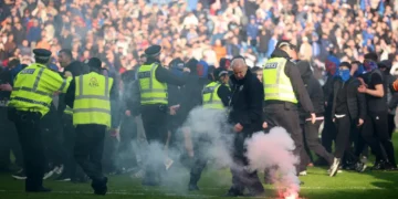 ‘Shameful’ pitch invasion by Celtic and Rangers fans condemned by police