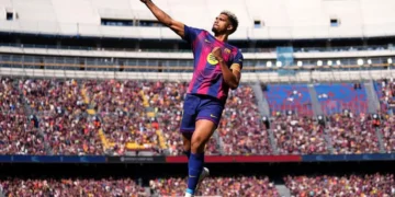Leaders Barcelona hang on to beat Rayo Vallecano