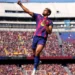 Leaders Barcelona hang on to beat Rayo Vallecano