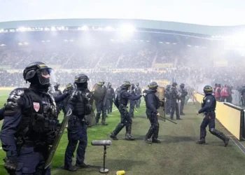 Ligue 1 game abandoned after fans invade pitch at relegated Nantes