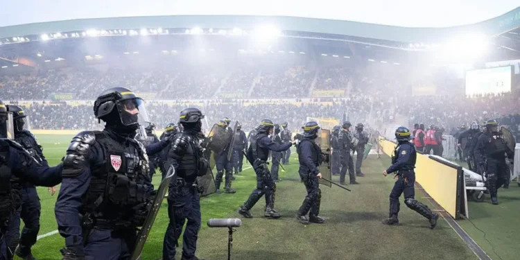 Ligue 1 game abandoned after fans invade pitch at relegated Nantes