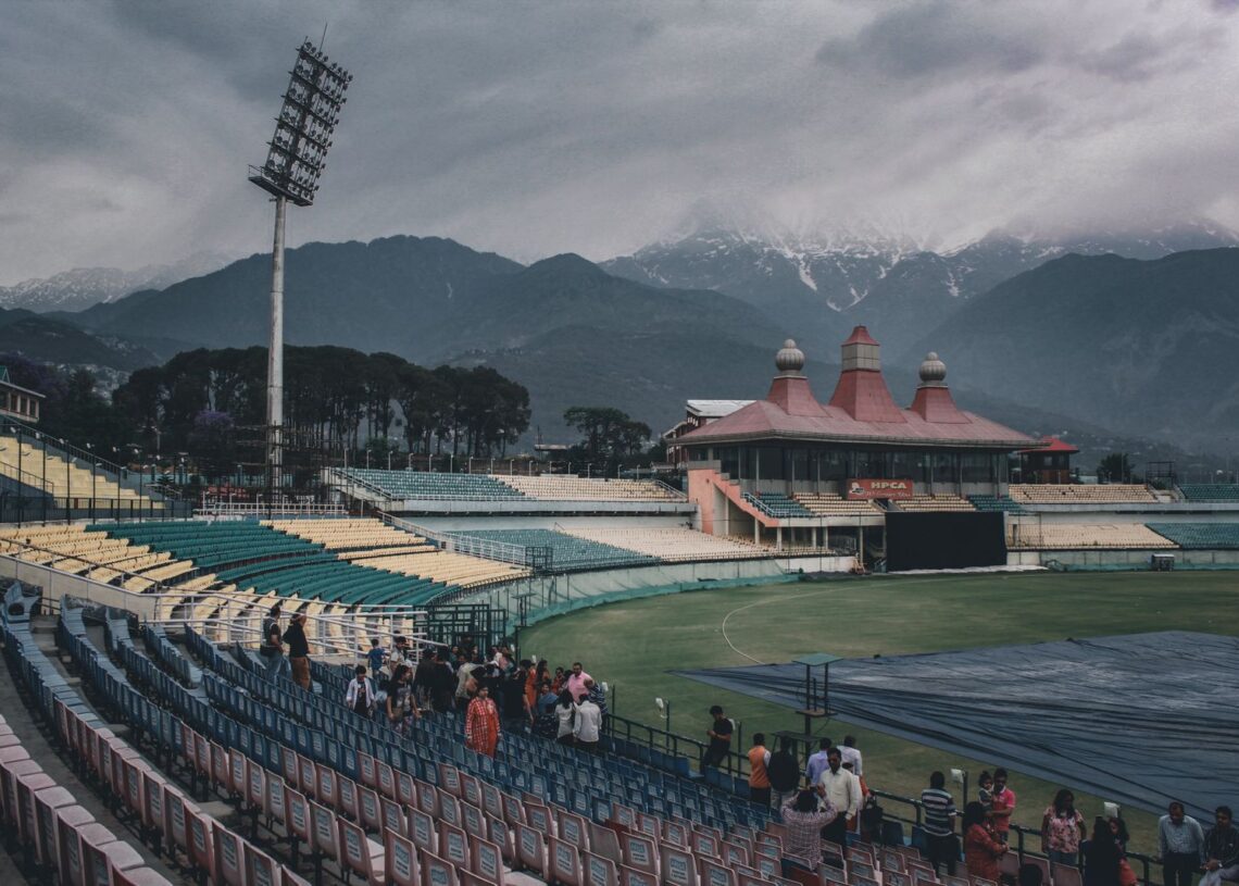 Covers on a cricket ground under heavy cloud, as rain wiped out the Asian Games cricket quarter-finals