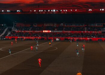 Football stadium at dusk with a match under way (Pexels 1657324)