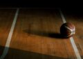 Chris Spatola tribute: a basketball resting on an empty hardwood court