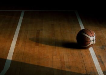 Chris Spatola tribute: a basketball resting on an empty hardwood court