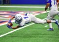American football receiver making a diving catch (Pexels 718952)