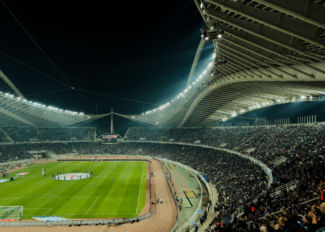 Floodlit football stadium at night (Pexels 30651230)