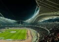 Floodlit football stadium at night (Pexels 30651230)