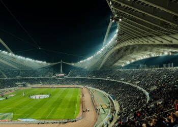 Floodlit football stadium at night (Pexels 30651230)