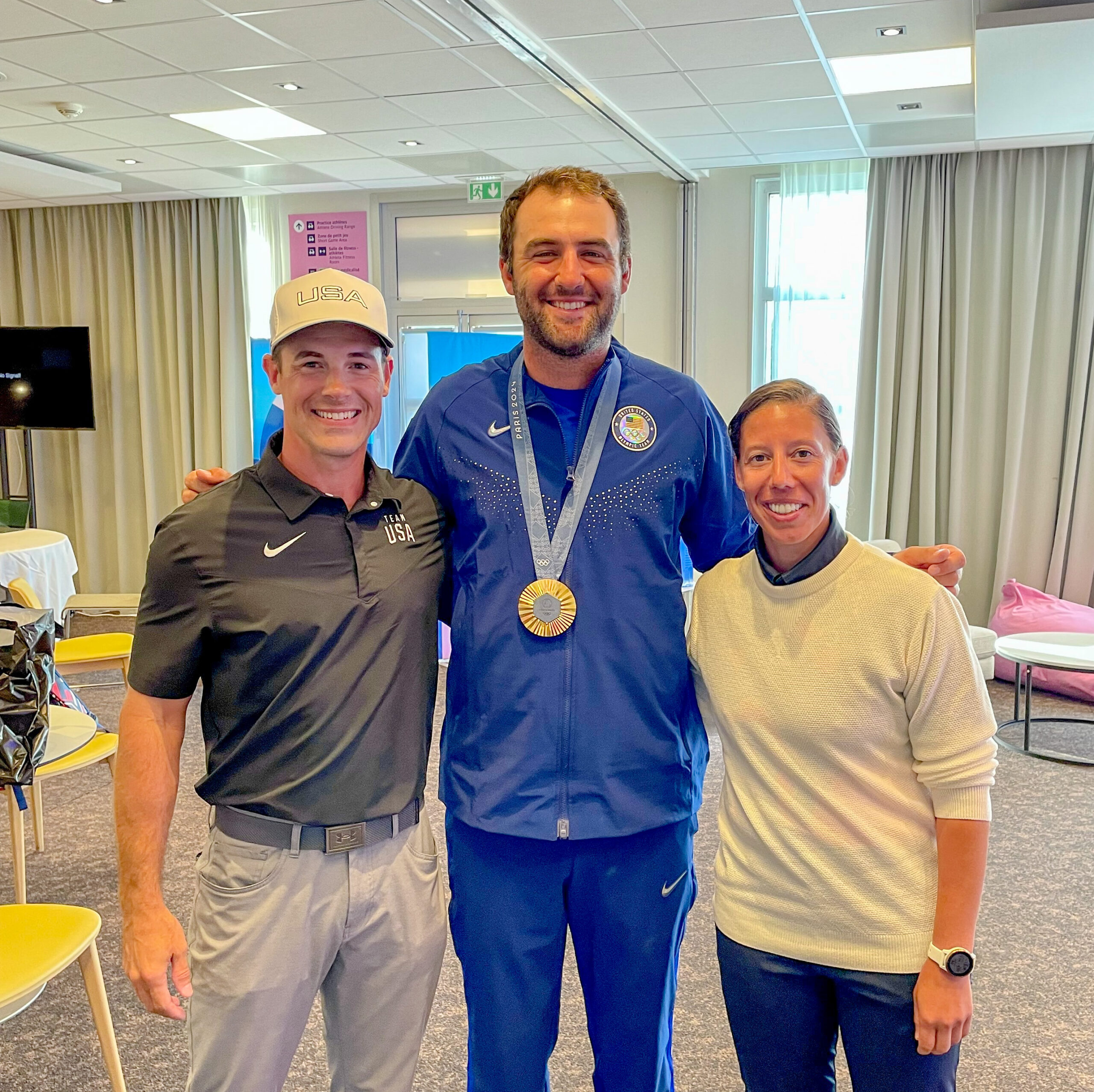 Scottie Scheffler wearing his Olympic golf gold medal at the Paris 2024 Games