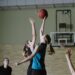 Lynx vs Fever: women basketball players contest a jump ball on an indoor court