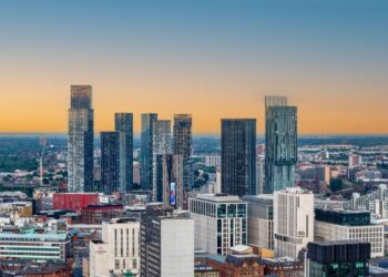 Manchester city skyline at sunset as the Man City 115 charges verdict lands