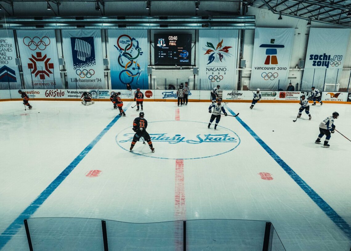 Ice hockey players warming up on an indoor rink, illustrating NHL preseason scores for September 25