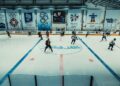 Ice hockey players warming up on an indoor rink, illustrating NHL preseason scores for September 25