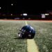 American football helmet on the field at night, Ole Miss vs Florida college football