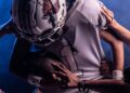 Texas A&M vs LSU: college football player carrying the ball through a tackle