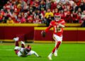 Patrick Mahomes scrambles for the Kansas City Chiefs, who beat the Raiders 30-27