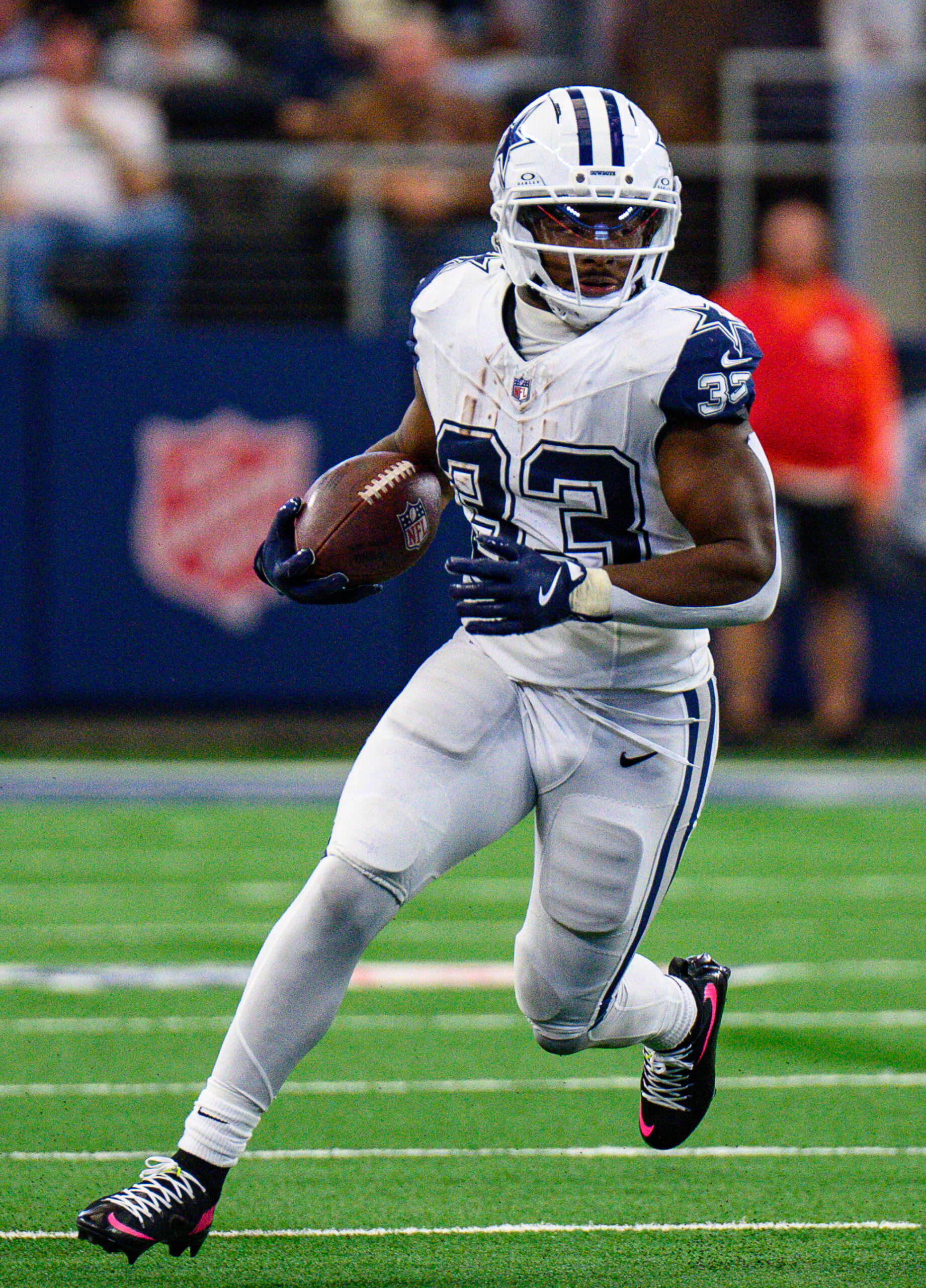 Javonte Williams carries the ball for the Dallas Cowboys
