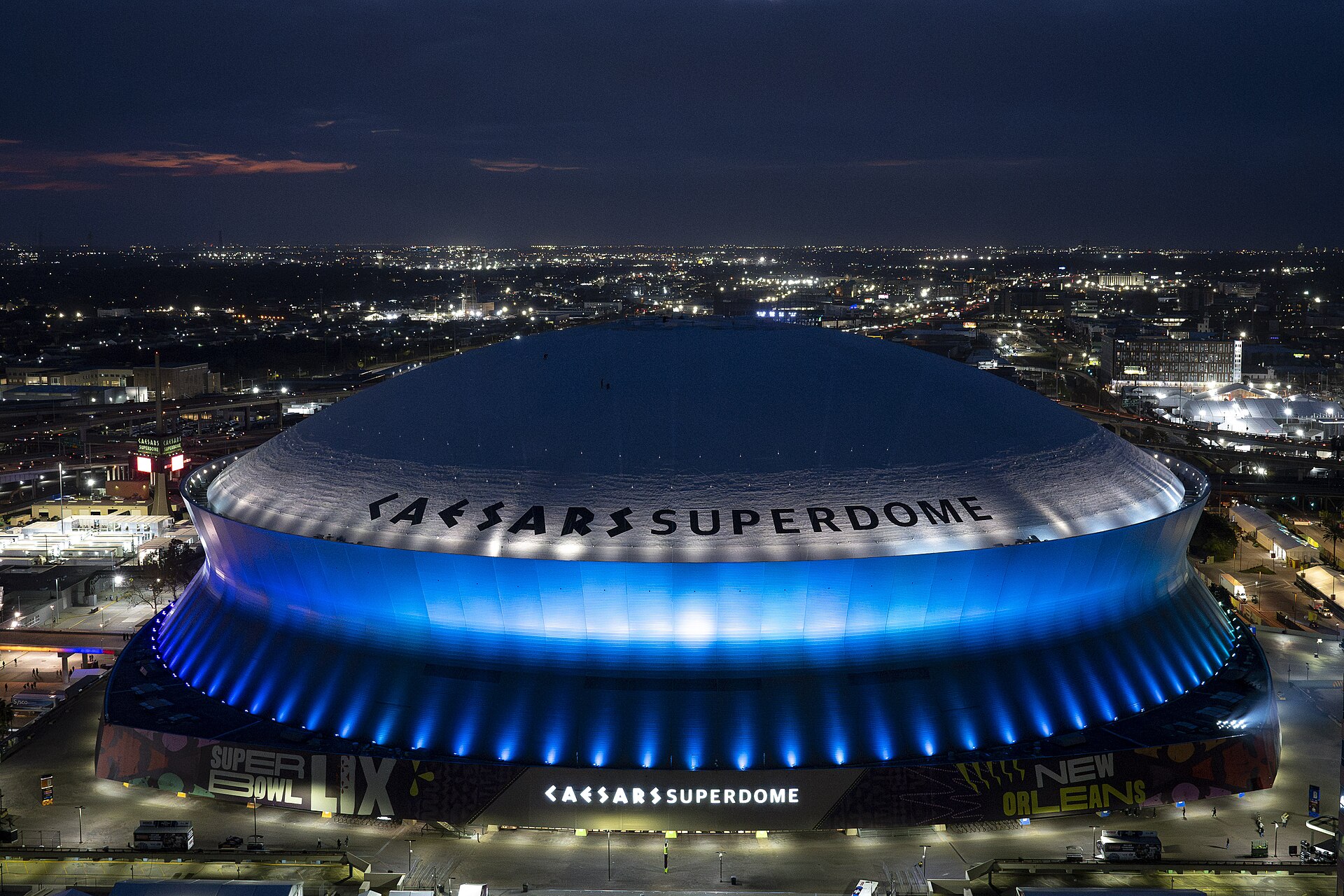 The Caesars Superdome in New Orleans lit up at night, venue of Falcons vs Saints